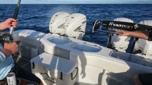 Fishing on the back of boat fishing charter Oahu Hawaii