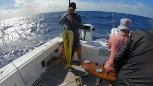 Sport fisherman holding caught fish sport Honolulu Hawaii