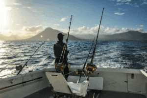 Ahi Fishing Oahu man standing on boat sport fishing yellowfin honalulu hi oahu hi